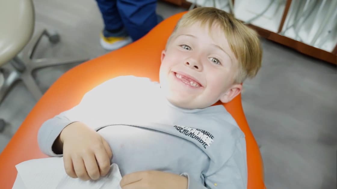 Smiling Child in Chair