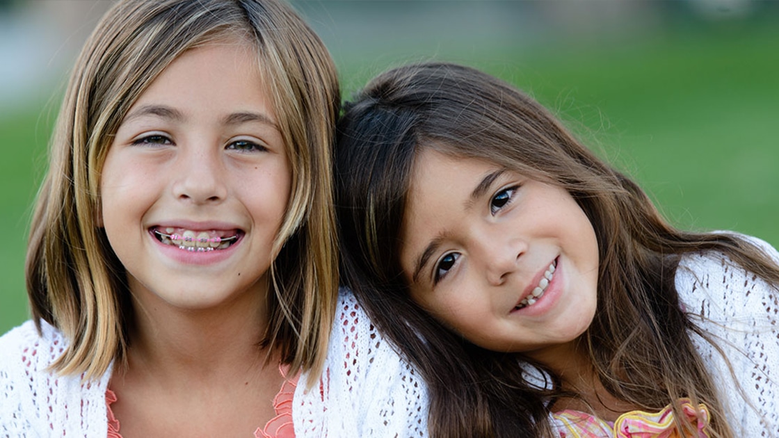 2 Sisters Smiling Together