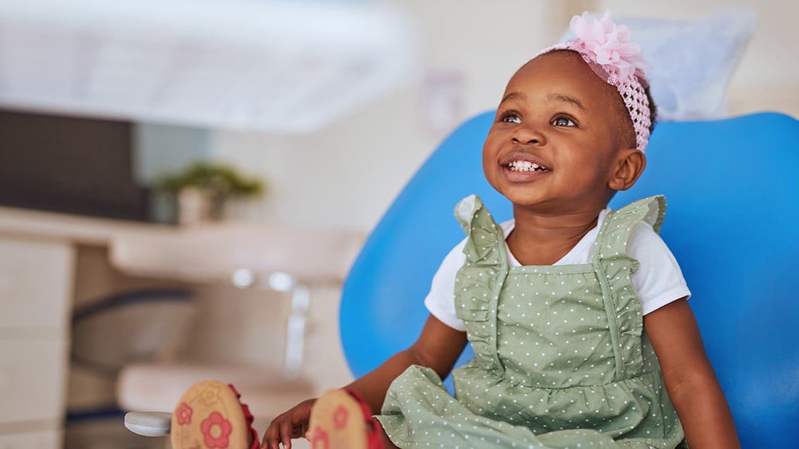 Smiling Toddler in Chair Photo